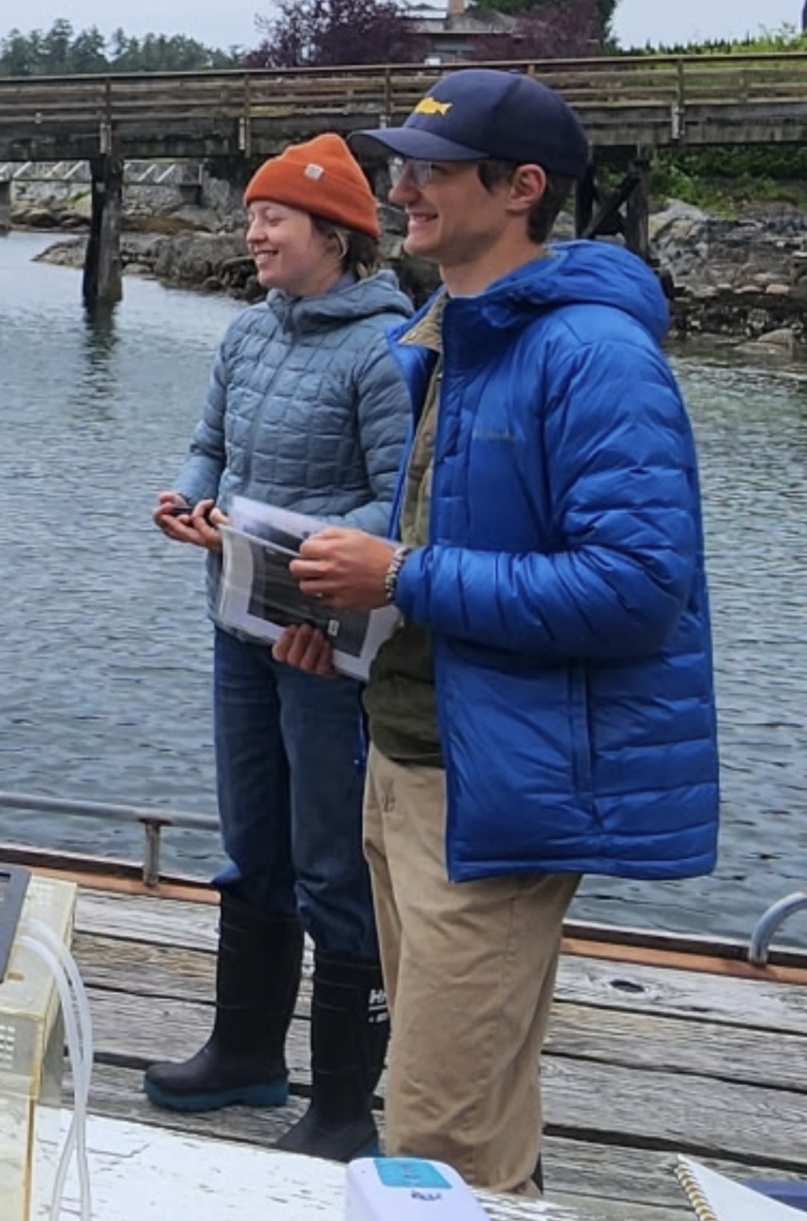 University of Toronto graduate researchers Erik Curtis and Kyra Ford deliver a dockside seminar on sea lice and salmon at Irvines Landing